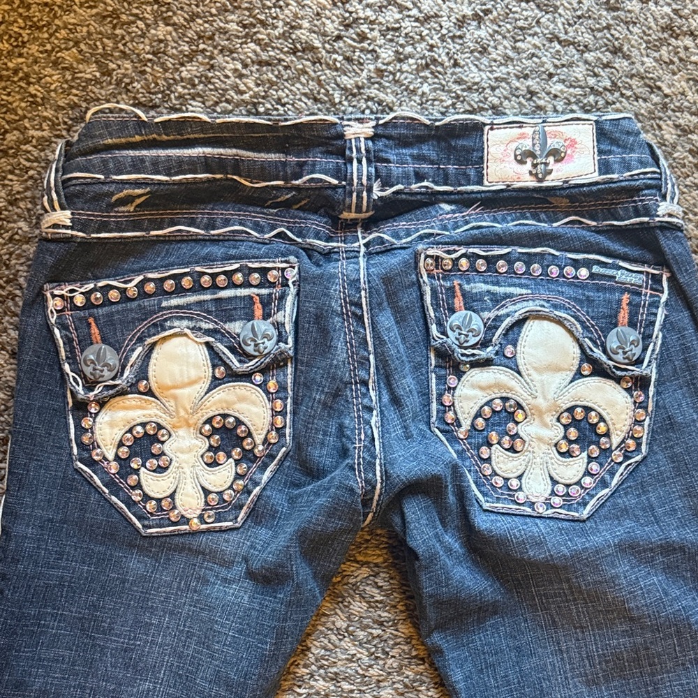 Embellished Blue Jeans with Fleur-de-Lis Design